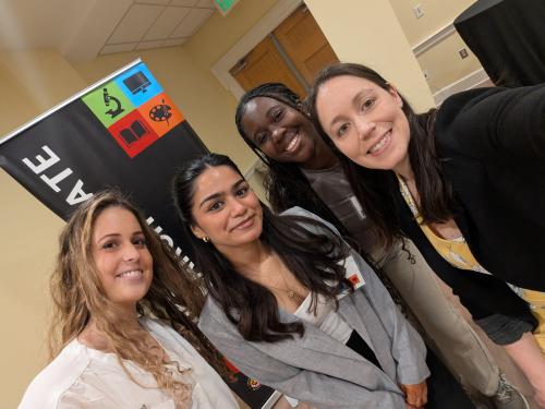 Photo of Rachel, Yamha, Dr. Yarger, and Davina at Undergraduate Research Day 2025