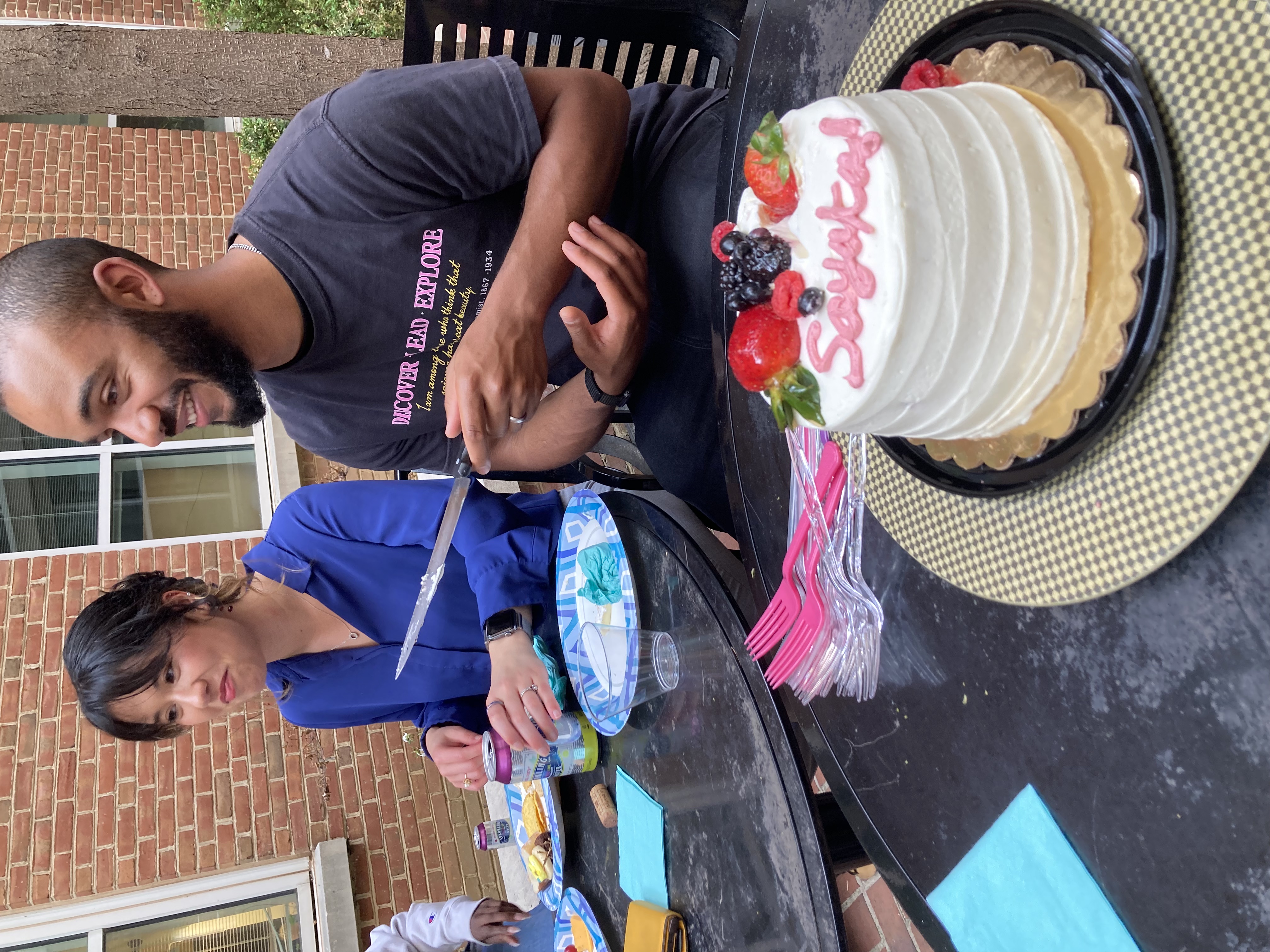 Cutting the cake at Sayaka's graduation party