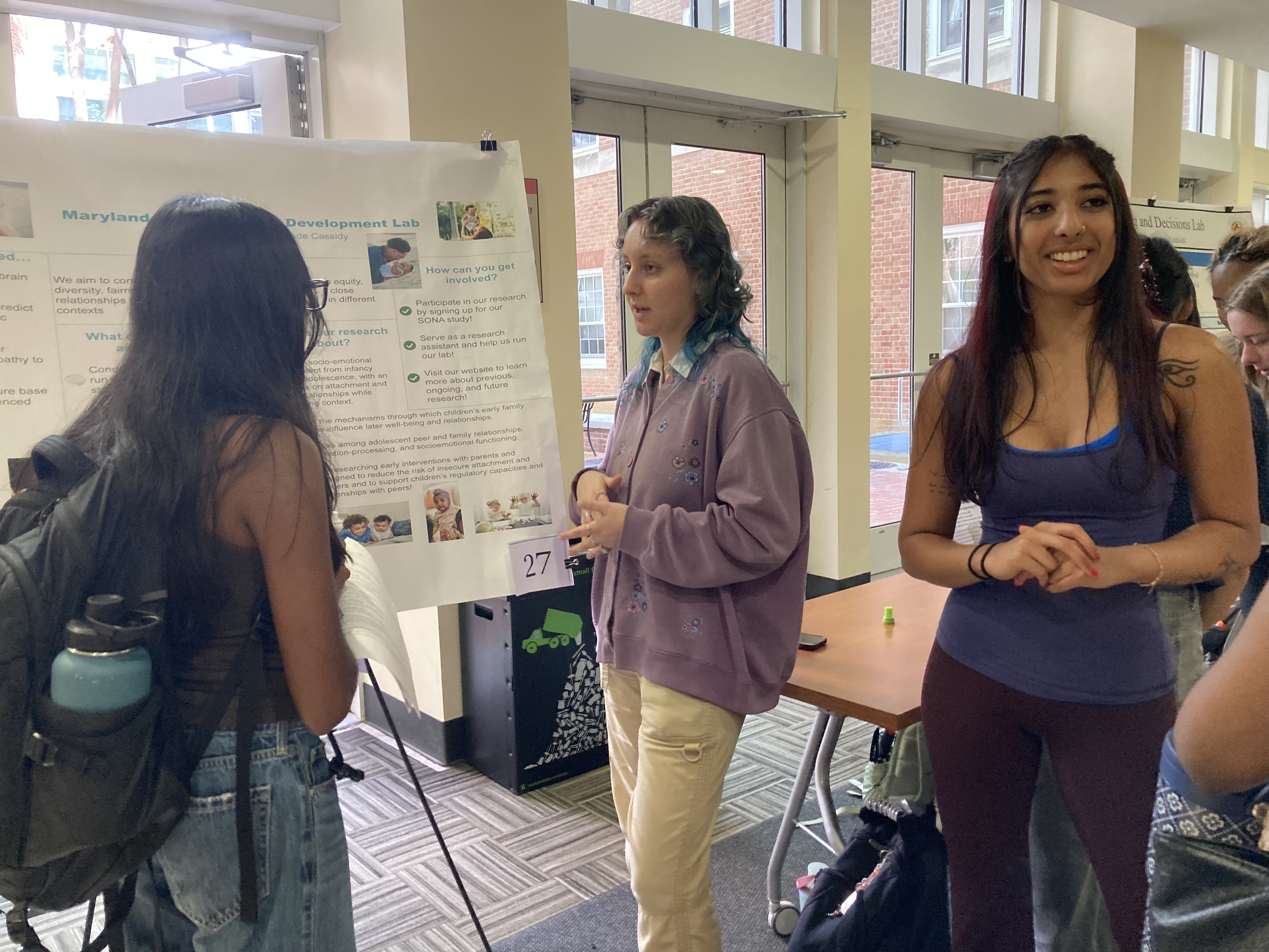 Our undergraduate RA Sahara (right) and lab manager Gwen (left) presenting to undergraduates at Welcome to PSYC Day 2026