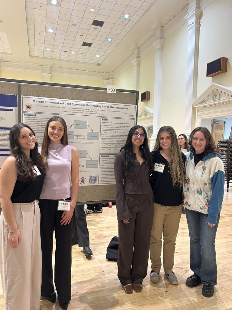 Our undergraduate RAs with their lab manager presenting their poster at the 2026 Undergraduate Research Day, from left to right: Gabi, Abby, Sahara, Rachel, Gwen