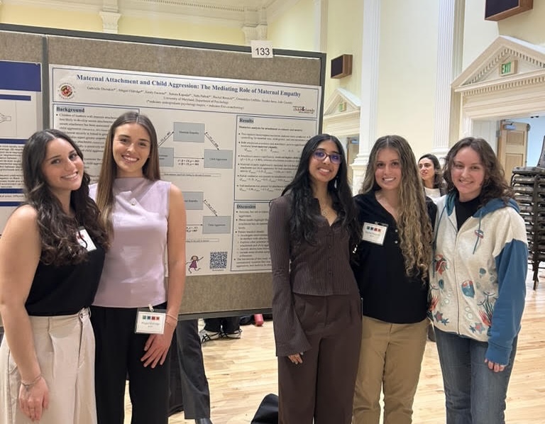 Our undergraduate RAs with their lab manager presenting their poster at the 2026 Undergraduate Research Day From left to right: Gabi, Abby, Sahara, Rachel, Gwen