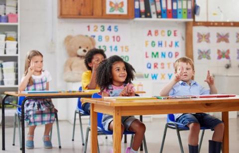 Kids sitting in a classroom 