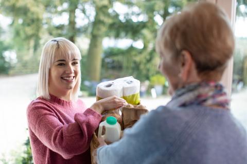 istock photo of a person helping a stranger